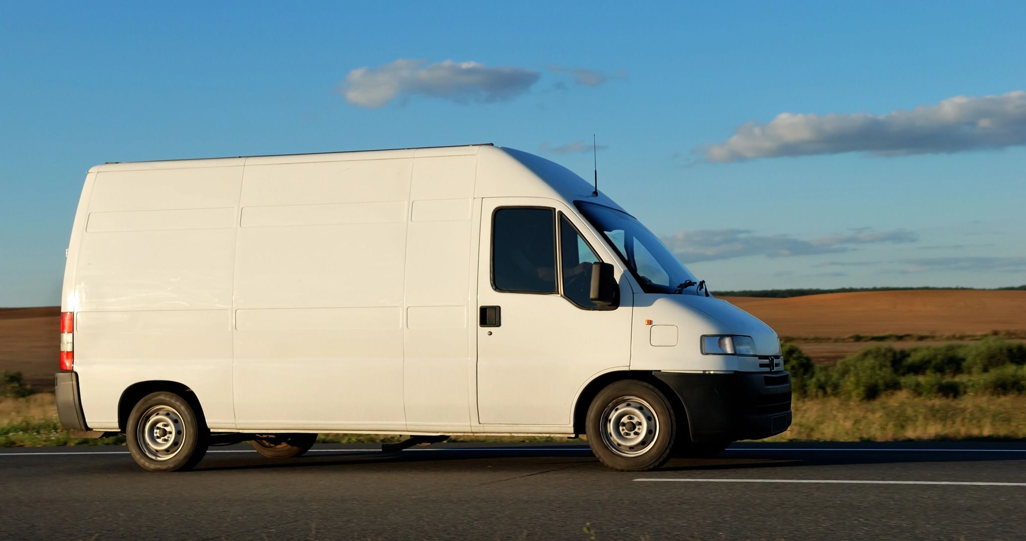 urgent-courier-van-emergency-delivery-service-on-country-road